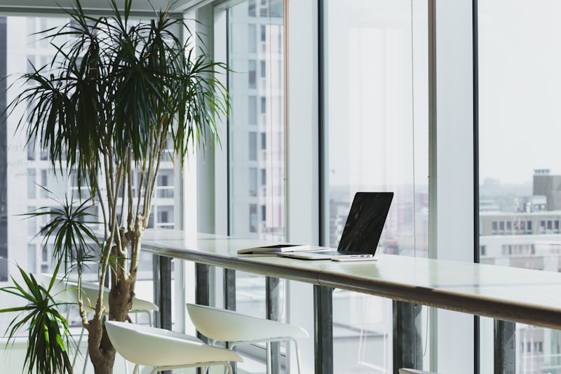 A minimalist workspace featuring a sleek laptop and clean design elements, reflecting the brand's focus on clarity and precision.