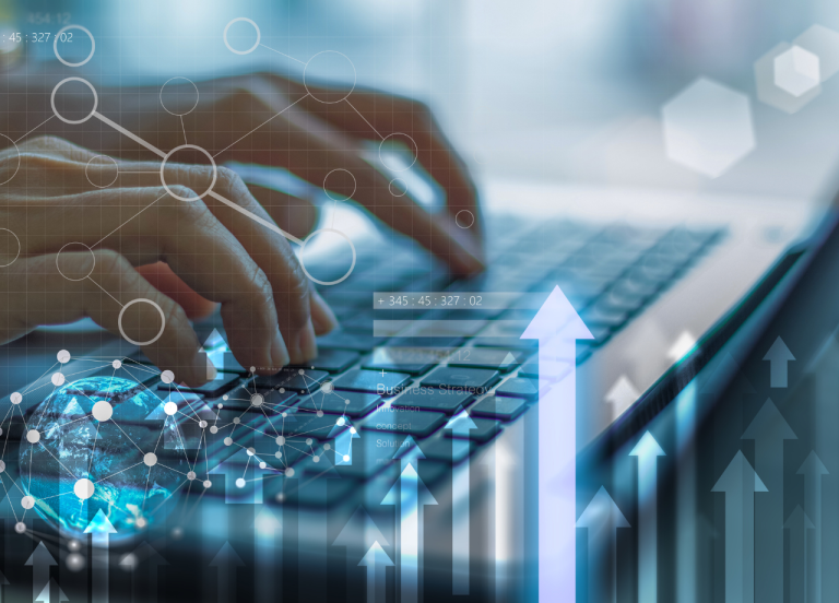 Hands on a laptop with data overlays representing AI content governance and strategy.