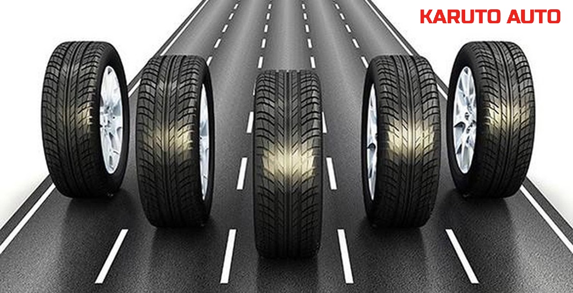 Kỹ thuật viên tại gara chuyên nghiệp đang kiểm tra độ cân bằng động sau khi thay lốp mới