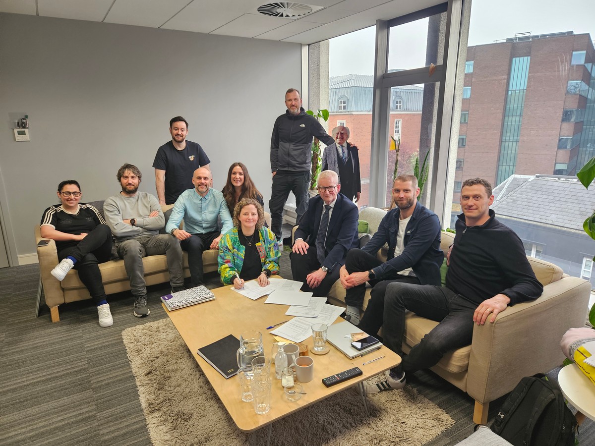 A diverse set of professionals collaborating on a strategy to balance volume with focused topical authority in AI content strategy.