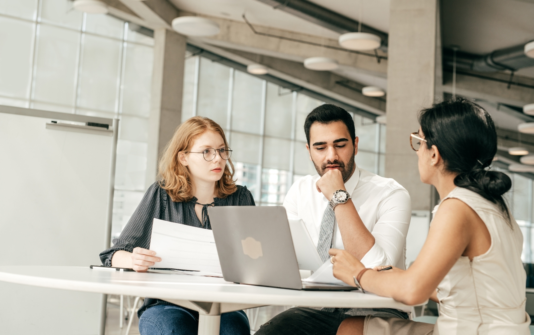 A creative marketing team brainstorming brand quirks on a whiteboard
