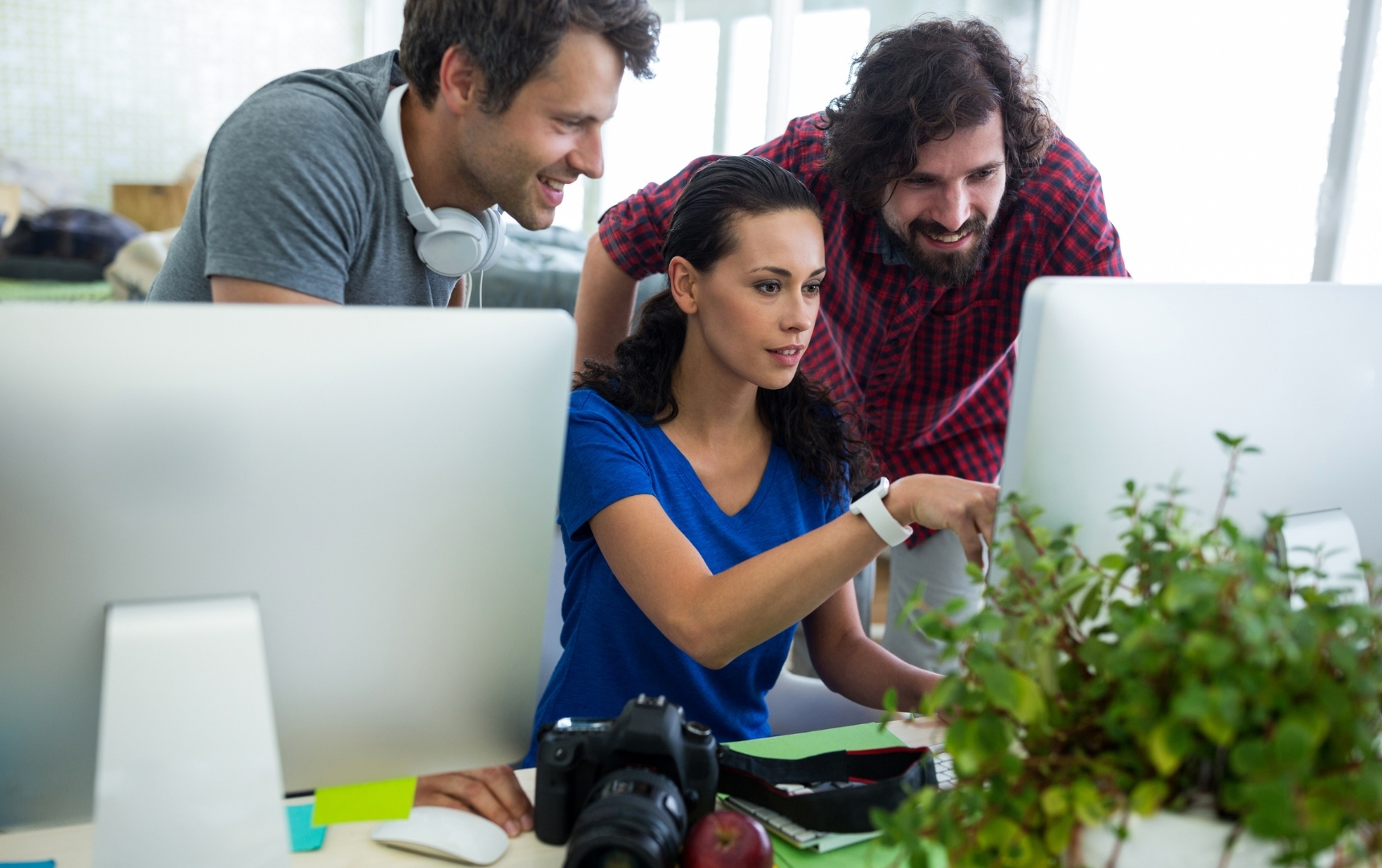 Marketing team reviewing content metrics on computers