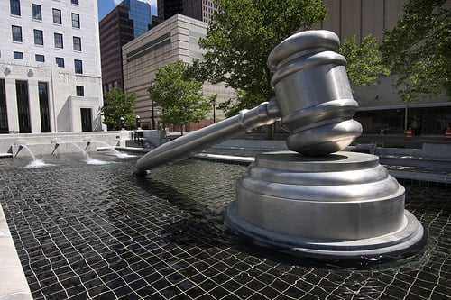 A gavel striking a sound block, symbolizing legal enforcement and copyright law