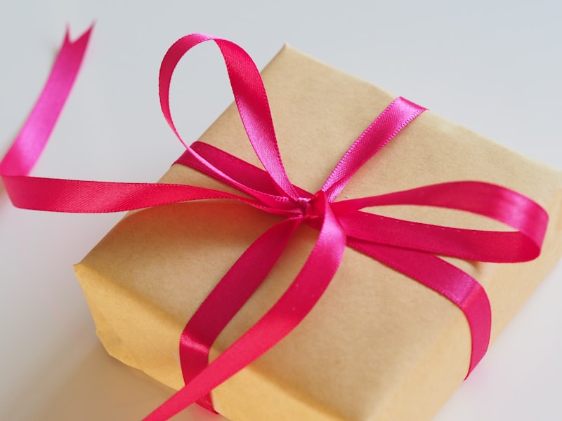 A close-up of hands exchanging a small, thoughtful gift, symbolizing relevant community incentives