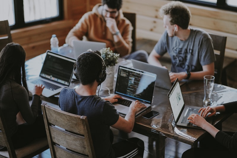 Brand-owned image of a diverse team collaborating around a digital strategy