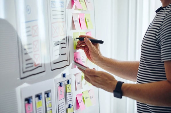 Marketing and sales teams collaborating in an open office environment