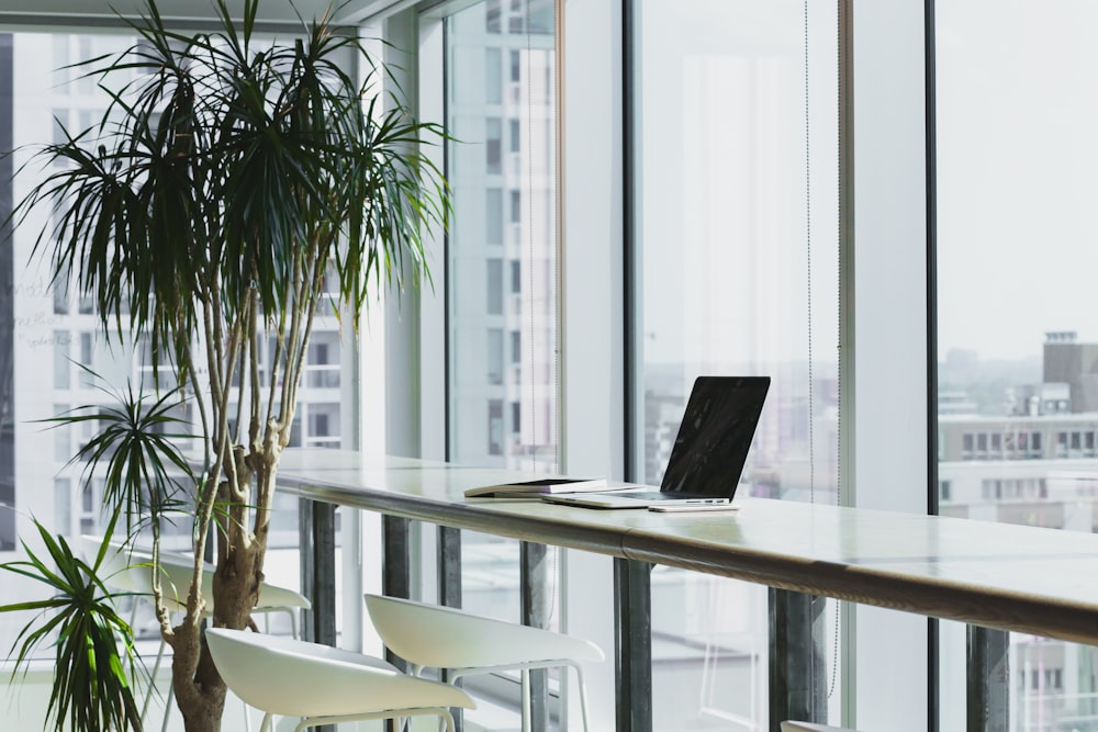 Modern workspace with multiple screens showing presentation design software