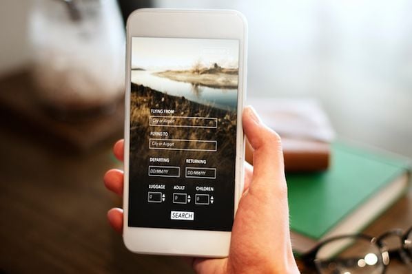 A clean, modern interface showing a mobile device with a responsive website layout