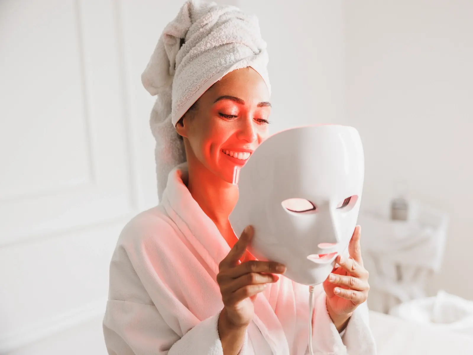 Woman gently touching her face, symbolizing skin recovery
