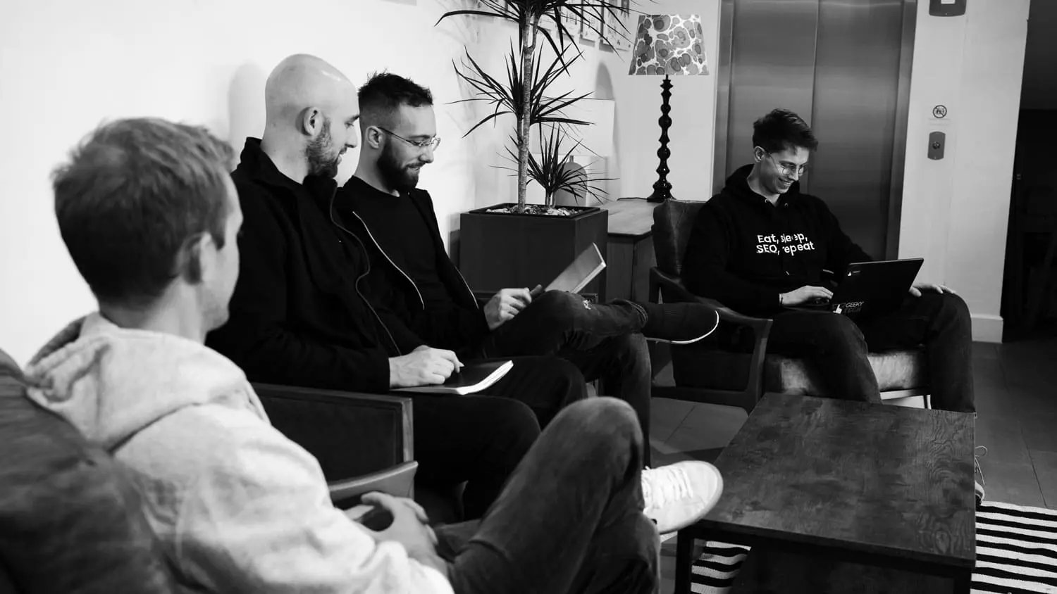 A team of digital marketing experts analyzing conversational search trends for better AI engine alignment.
