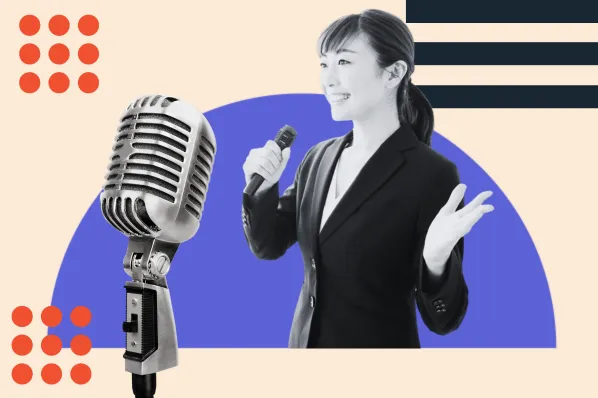 A professional speaker engaging with an audience in a modern conference setting