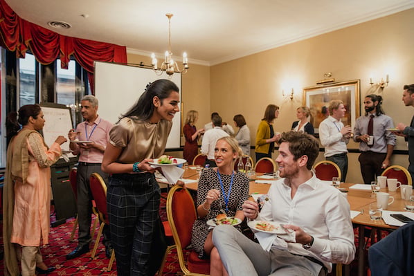 Professional networking group engaging in conversation