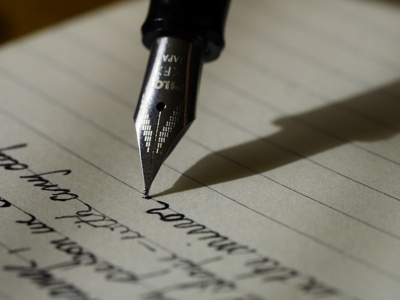 A close-up of a notebook with handwritten notes and a pen, symbolizing planning and reflection