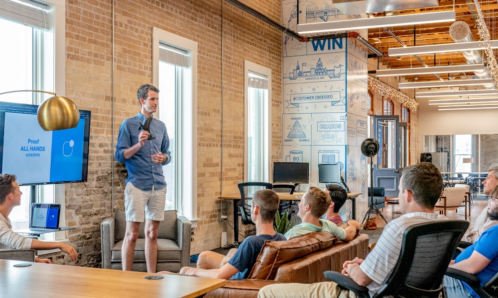 alt: A CEO and CMO having a focused discussion in a modern office setting