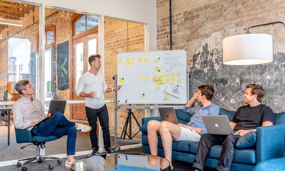 alt: Cross-functional teams from marketing, sales, and product collaborating in a meeting